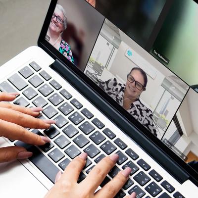 Ladt participating in live Zoom event on laptop