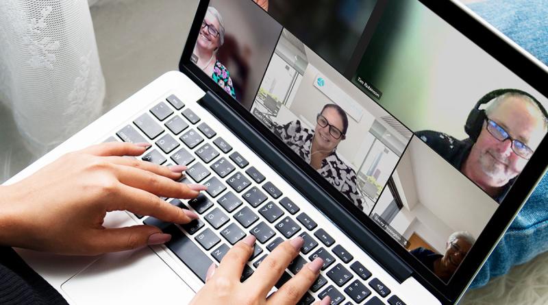 Ladt participating in live Zoom event on laptop