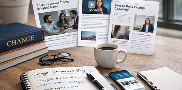 Desk with books, notepad, coffee and phone on it