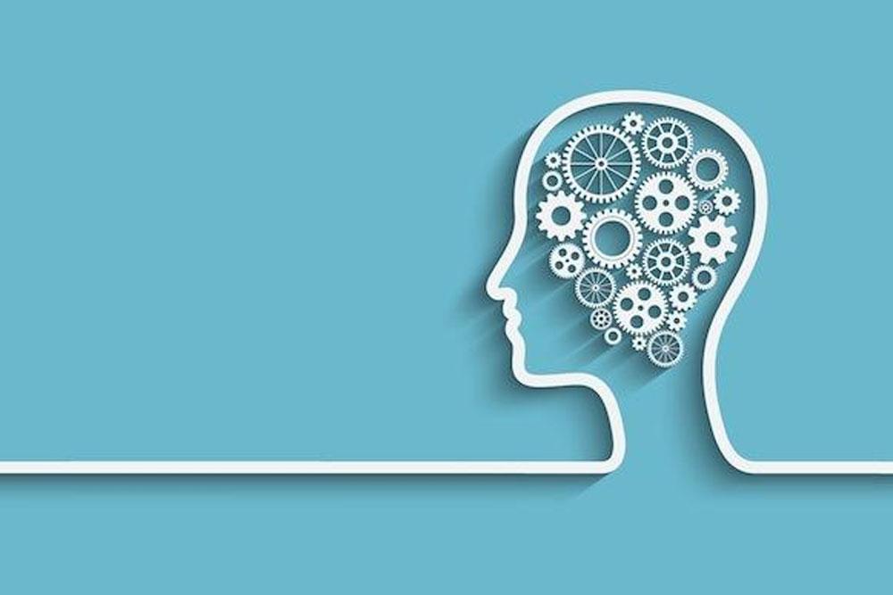 Simp0le line drawing of a mind with cog and line on a turqoise background