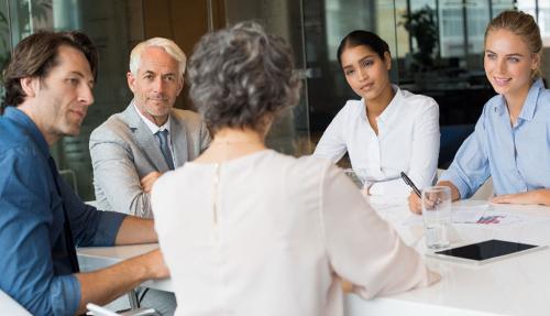 Professionals sitting at board meeting