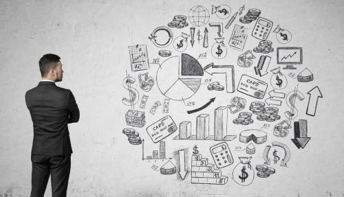 Man in suit staring at sketched concepts of uncertainty