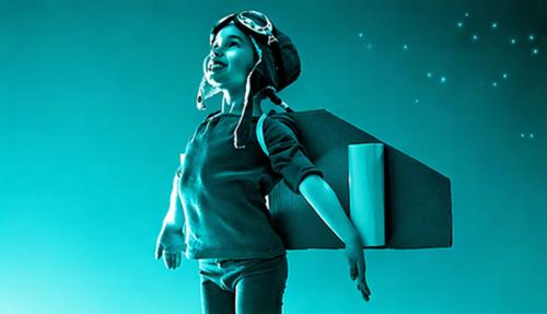 Child with wings pretending takeoff  turquoise background