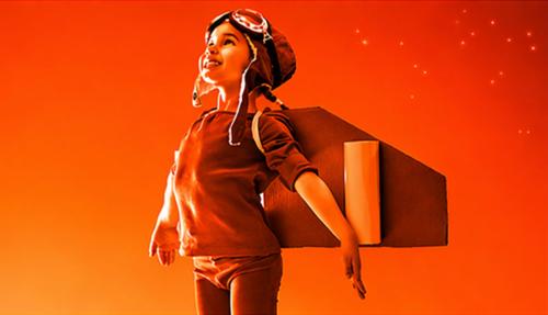 Child with wings pretending takeoff  bright orange background