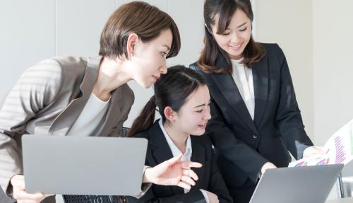 Asian business ladies on laptops