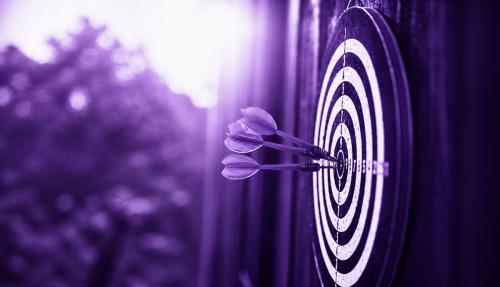 Dartboard with purple background