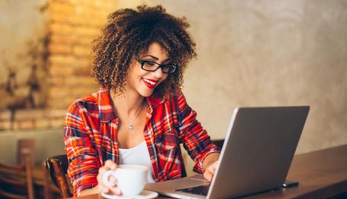 Young woman on laptop on desk