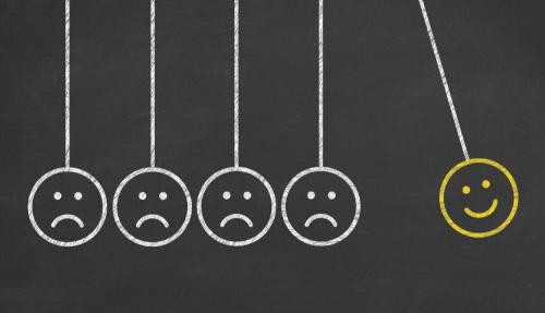 Smiley faces drawn on a blackboard